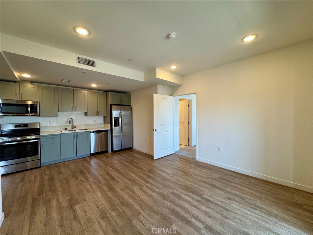 Experience elevated city living in the heart of Koreatown at 1025 S. Berendo St., Unit 303. Located in a sleek, modern 2019-built secured building, this sun-drenched 2-bedroom, 2-bathroom unit offers the perfect blend of style, comfort, and convenience.
Situated on the third floor with east-facing exposure, this thoughtfully designed layout features two spacious ensuite bedrooms flanking a bright, open living area—ideal for privacy, entertaining, or working from home. Natural light floods the space, accentuating the modern finishes and generous proportions throughout.
Enjoy the perks of full-size, in-unit front-load laundry, a tankless water heater, stainless steel appliances (including refrigerator, dishwasher, stove, and microwave), and two assigned parking spots—with EV charging available.
The building offers controlled access, Amazon package lockers, and security cameras for added peace of mind. Step outside and you’re directly across from a popular Korean market, with easy access to major freeways, shops, and local hotspots.
Spacious walk-in closets, a premium layout, and an unbeatable location—Unit 303 isn’t just a place to live. It’s a place to thrive.