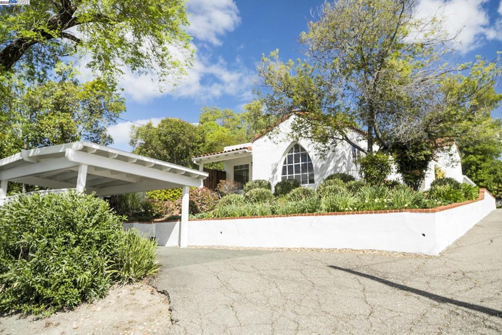 Incredible opportunity to own a single family with attached ADU on the highly desirable Westside of Danville. Just a short walk to downtown shops, restaurants, and the Iron Horse Trail, this charming property sits on a generous 12,632 sq ft lot and features two separate units, each approximately 1,200 sq ft. The front unit offers 2 bedrooms and 1 bathroom and is filled with character and natural light and too many updates to list. Highlights include a striking arched window, hardwood floors throughout, arched doorways, and fresh interior paint, new roof, newer furnace and water heater. Lovely updated kitchen features white cabinets, beautiful countertops and plenty of cabinet space. A spacious, private backyard includes a large deck, mature landscaping, and established garden beds. This unit has a strong rental history and typically leases for $4,000 per month. HUGE driveway with potential to house RV and/or boat plus 2 carports. Rear unit includes 2 bedrooms and 1.5 bathrooms with a cozy family room, brick fireplace, and skylights. The galley kitchen provides efficient layout and functionality, and the unit also includes ceiling fans and laundry facilities. Currently rented to a reliable month to month tenant at $3,000 p/mo.