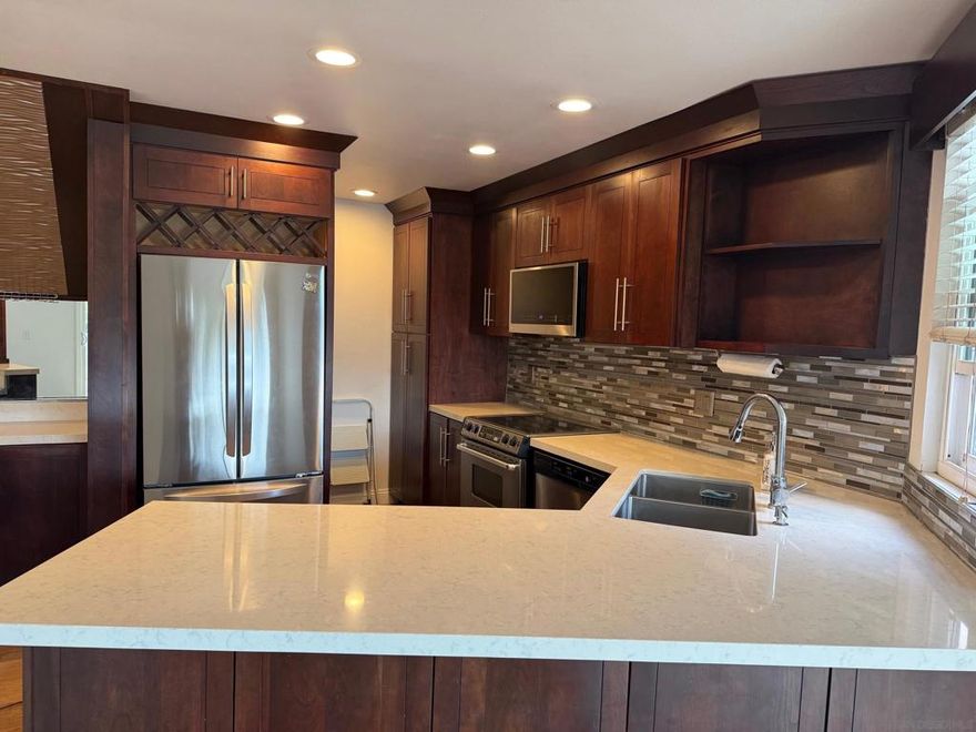 Completley renovated corner unit with gourmet kitchen, Quartz counter tops and stainless steel appliances. Wood flooring through out the living space, vaulted ceilings, dual pane windows and large patios. Large primary bedroom with renovated bathroom, mirrored closet doors and bedroom retreat perfect for an office with two car attached garage  The complex features pool, spa, tennis courts and recreation area. Easy access to shops, restaurants and freeways.
