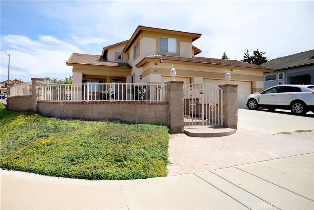 This stunning Conner lot home in two-story residence in Spring Valley offers 5 spacious bedrooms and 3 full bathrooms, including the convenience of one bedroom and bath on the main floor—perfect for guests room. The grand entrance features soaring cathedral ceilings, leading to elegant wood and tile flooring throughout. Enjoy multiple living spaces including a separate living room, formal dining room, and a cozy family room with a fireplace. The gourmet kitchen boasts granite countertops and rich cherry wood cabinets, ideal for both everyday meals and entertaining. A perfect blend of comfort, style, and functionality! roomy Master bed with walk in closet, master bath with shower and bath tub. Big Back yard is another entertainment for family gathering with special occasion. Home is convenience near freeway, School, Shopping. Beautiful, peaceful and quite neighborhood.