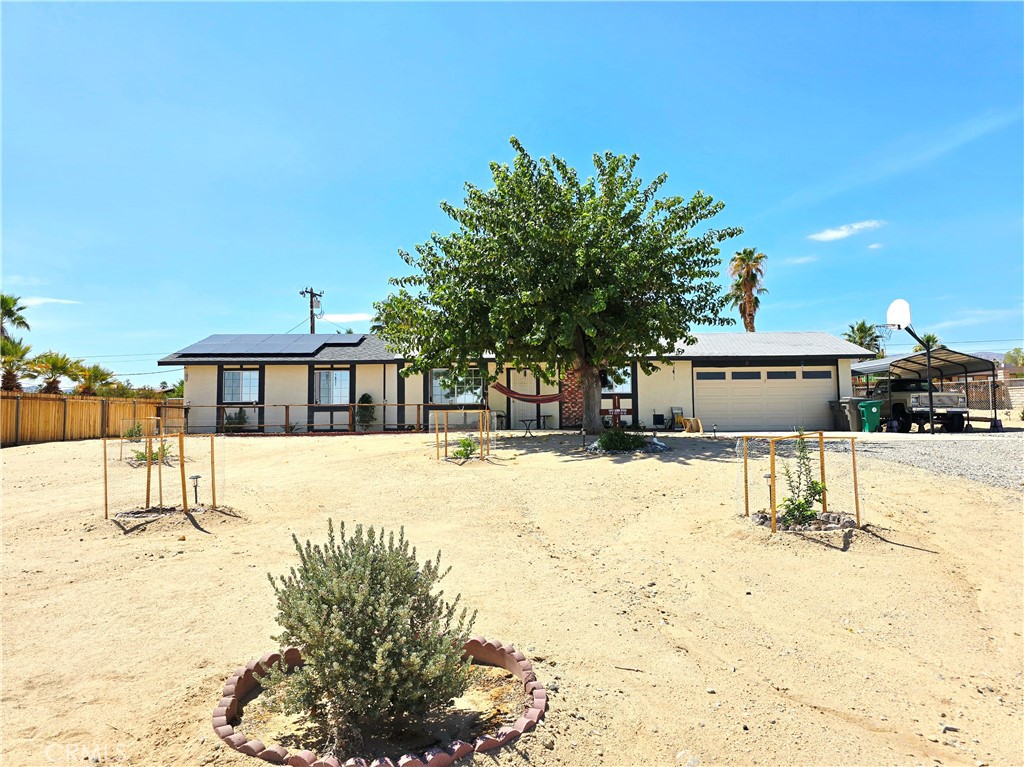 Investment Alert! This 4 Bedroom 2 Bath home is an Easy Fixer with great Views and situatied in a quiet, well established neighborhood. Sitting on the view side of the street, this home has unobstructed views to the north. Central heat and AC with a fireplace in the living room. The split floorplan provides additional privacy for the family, and there is the added convienience of an individual laundry room with garage access. Have a boat or trailer? There is an additional covered parking spot next to the garage. The fanced back yard is large and has a wooden deck perfect for an above ground pool. A newer solar system helps reduce utility costs, making this home a smart investment. Whether you're looking to update and customize or simply enjoy a spacious home in a prime location, this property offers fantastic potential. Don’t miss out on this great opportunity!
