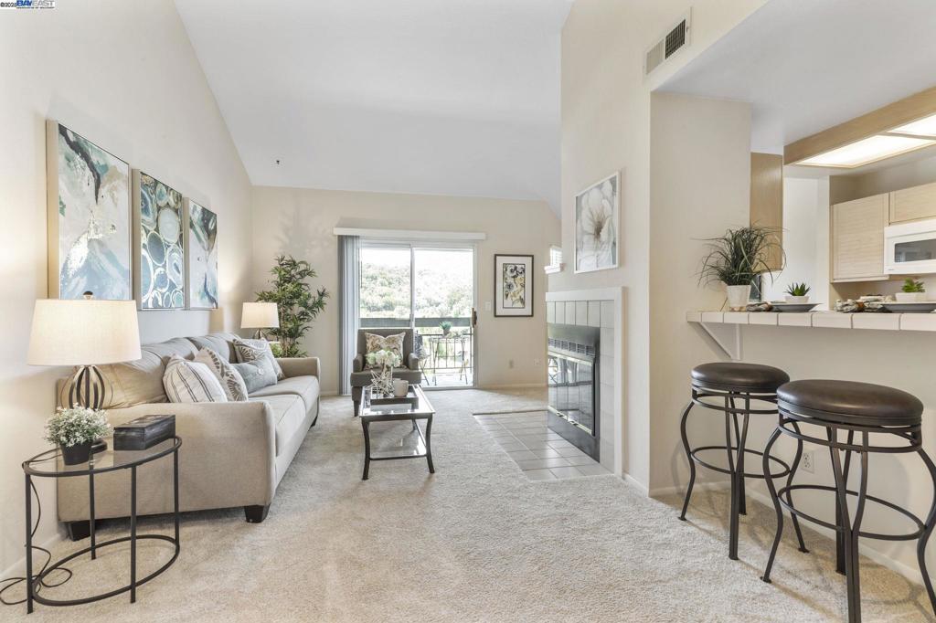 Welcome to this well-maintained 2nd-floor condo in the highly sought-after Canyon Meadows community. ONLY FIVE STEPS UP TO THE FRONT DOOR! This home features a clean original condition with a bright, open floor plan, a cozy wood-burning fireplace, and a private balcony with AMAZING VIEWS and NO direct rear neighbors! The unit includes a detached 1-car garage and ample visitor parking for added convenience. Enjoy resort-style living with HOA amenities that include two pools, a spa, tennis courts, basketball and volleyball courts, a clubhouse with gym, car wash area, and water and heated water included in HOA dues. Located within the award-winning Pleasanton school district, and offering easy access to major commuter routes, BART stations, shops and restaurants, this condo is priced below comps—don’t miss this incredible value!