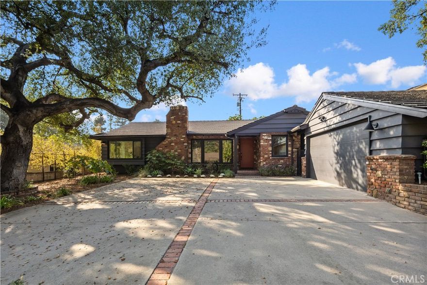 This beautifully remodeled residence, located on one of the most picturesque streets in Arcadia’s coveted Highland Oaks neighborhood, perfectly blends timeless elegance with modern comfort. The open and inviting floor plan showcases refinished solid hardwood floors, new tile flooring, and abundant natural light streaming through all-new windows and sliding glass doors. The chef’s kitchen is a masterpiece, featuring custom cabinetry, sleek quartz countertops, designer tile backsplash, and a spacious walk-in pantry. Every system has been thoughtfully updated, including upgraded electrical and plumbing, high-speed internet cabling, and new HVAC system with UV sanitizer. Additional highlights include a brand-new roof and rain gutters, stylish exterior lighting, and refreshed landscaping that enhances the home’s inviting curb appeal. Combining modern amenities with the serenity of the Highland Oaks community and prestige of the Arcadia Unified School District, 1709 Alta Oaks Drive represents a rare turnkey opportunity in one of Arcadia’s most sought-after neighborhoods.