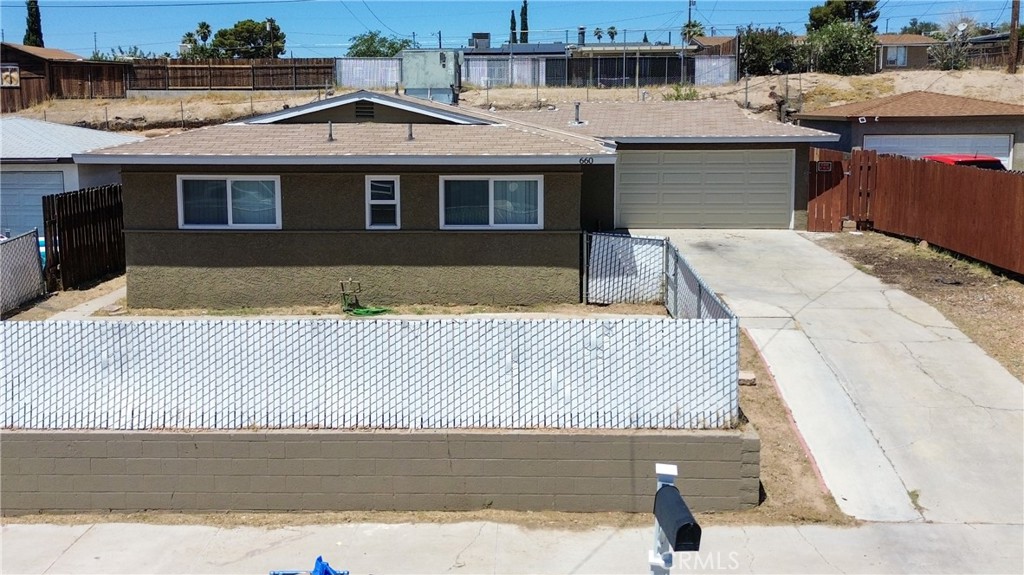 Welcome to this beautifully updated 5-bedroom, 2-bathroom home in the heart of Barstow! Thoughtfully enhanced over the past two years, this spacious residence offers comfort, modern touches, and a family-friendly layout—all just minutes from local schools, parks, and shopping. Step inside to discover newer laminate flooring throughout, complemented by fresh interior paint that gives the home a clean, contemporary feel. The upgraded kitchen features elegant quartz countertops perfect for daily living. Enjoy cozy evenings in the living and dining area, complete with a fireplace that serves as a charming focal point. The generous layout includes five well-proportioned bedrooms, ideal for large households, multi-generational living, or creating a home office or guest room. Outside, the long driveway offers plenty of parking for vehicles, toys, or even a small RV. The front yard is perfect for soaking in the scenery and offers a welcoming space to relax or garden. Located just steps from Cameron Elementary, and minutes from Barstow High School, grocery stores, freeway access, and dining, this home offers both convenience and comfort.