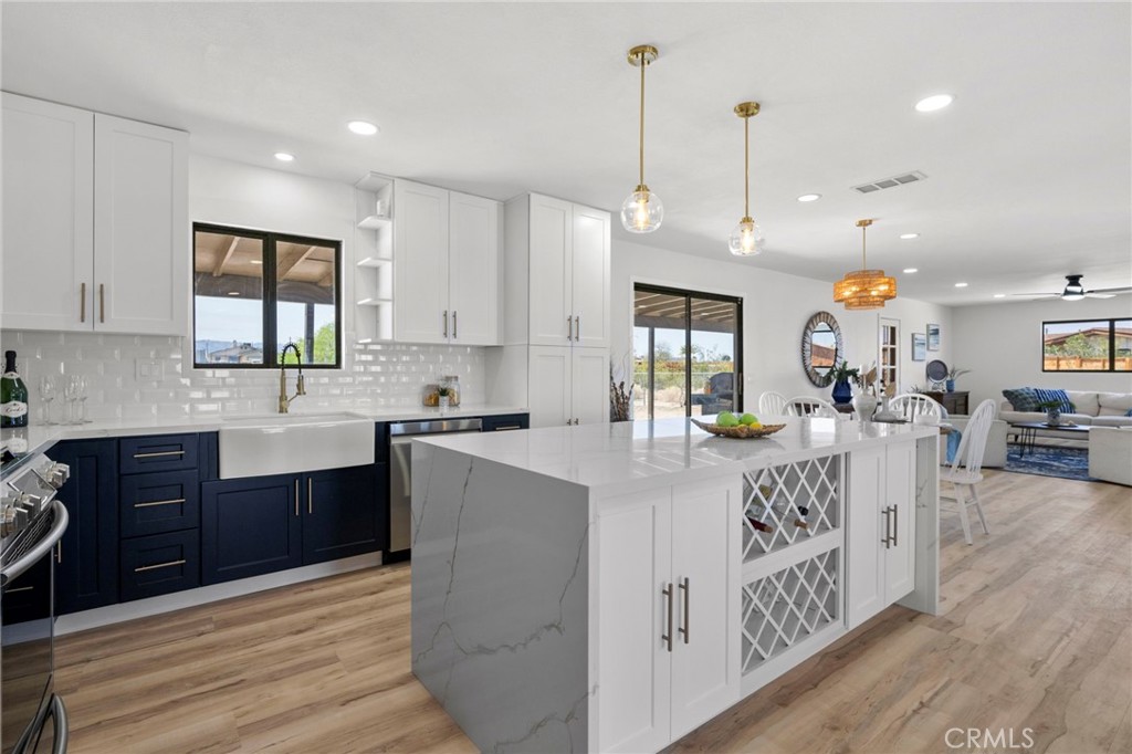 Welcome to this beautifully renovated 4-bedroom, 2-bathroom home nestled in a desirable neighborhood of Twentynine Palms! This stunning property boasts a spacious living room and family room, perfect for gatherings and relaxation. The modern kitchen is a chef’s dream, featuring a large island, sleek quartz countertops, and brand-new appliances. Freshly painted inside and out, this home is move-in ready!
Enjoy energy efficiency with installed solar panels on the roof, helping you save on utility costs. The home also includes a brand-new garage door and offers a large front and backyard, providing the perfect blank canvas for your personal landscaping vision. Not forgetting
the backyard fire pit under the stars and create unforgettable memories.
Don’t miss this incredible opportunity—schedule your private tour today!