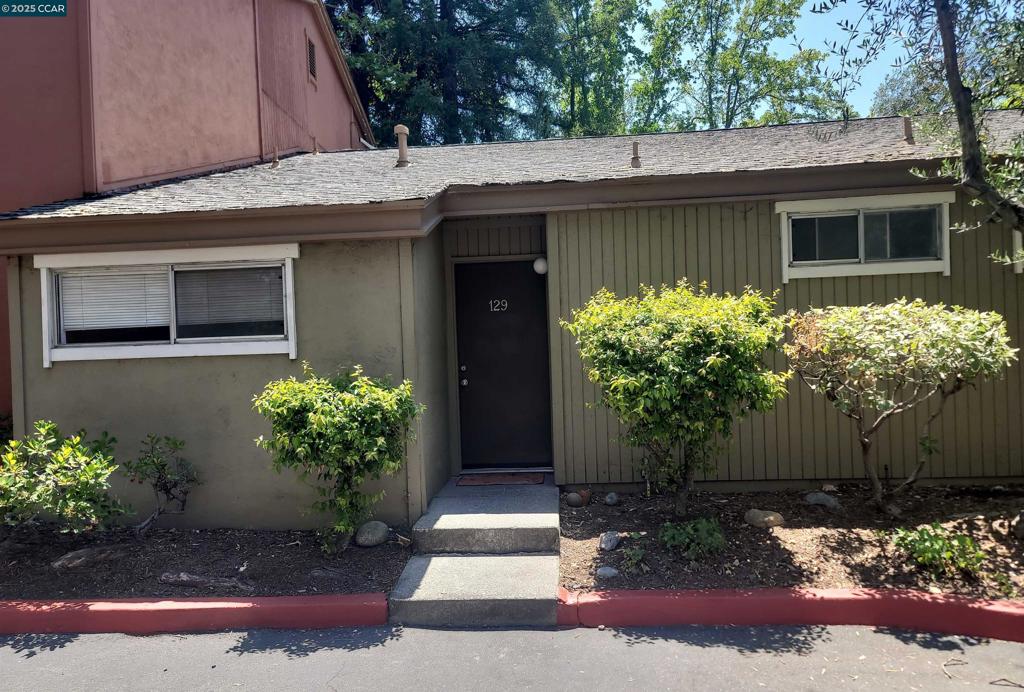 Located near the Walnut Creek border, this modern and spacious standalone unit offers over 800 square feet of comfortable, stylish living. Featuring 1 bedroom and 1 bathroom, the home boasts soaring vaulted ceilings, a cozy gas fireplace, and a charming step-down living room that opens to a formal dining area. The updated kitchen is equipped with contemporary appliances, solid stone countertops, and ample cabinet space to meet all your culinary needs.The generous bedroom includes a large closet for easy organization, while the private patio offers additional outdoor storage and a peaceful space to unwind. A secure, shared community laundry facility is conveniently located in a nearby detached structure. Carport parking is included. Ideally situated close to shopping, dining, and transportation—just minutes from Costco, Trader Joe’s, Peet’s Coffee, Pleasant Hill BART, and more—this is the perfect blend of convenience and lifestyle.
