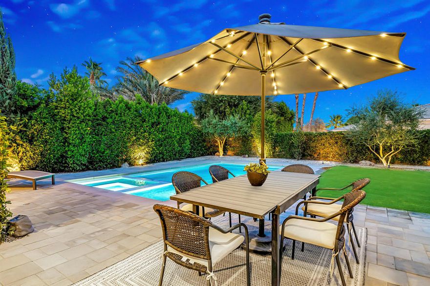 Welcome to The Orchard -- a rare desert retreat showcasing every upgrade imaginable!This beautifully reimagined 4-bedroom, 3.5-bath home offers modern style, thoughtful design, and resort-inspired living. The floor plan provides excellent separation, with the primary suite privately tucked away on one side of the home and three spacious guest bedrooms on the other. Each guest room features custom California-style built-in closets, adding both elegance and functionality.The chef's kitchen has been completely renovated with sleek new cabinetry, quartz countertops, and stainless steel appliances. Porcelain tile flooring flows throughout the home, tying each space together with contemporary sophistication. Two versatile office spaces make working from home easy, while smart-home features add convenience to your daily life.Step outside to your brand-new pool and spa, completed just two weeks ago. Designed with a tanning ledge, surrounded by all-new pavers, and enhanced by refreshed landscaping, this backyard is the ultimate setting for relaxation and entertaining.Additional highlights include:Two fireplaces (living room and courtyard) for indoor and outdoor ambianceTwo newer AC units (just 4 years old) for comfort and efficiency year-roundThree-car garage offering plenty of storage and parkingLow HOA dues of only $225/monthLocated in a desirable neighborhood that allows short-term rentals, this property is perfect as a primary residence, vacation getaway, or income-generating investment -- especially for festival-goers and seasonal visitors. Don't miss this rare opportunity to own a completely updated desert home with a brand-new pool, spa, and every upgrade already completed for you!