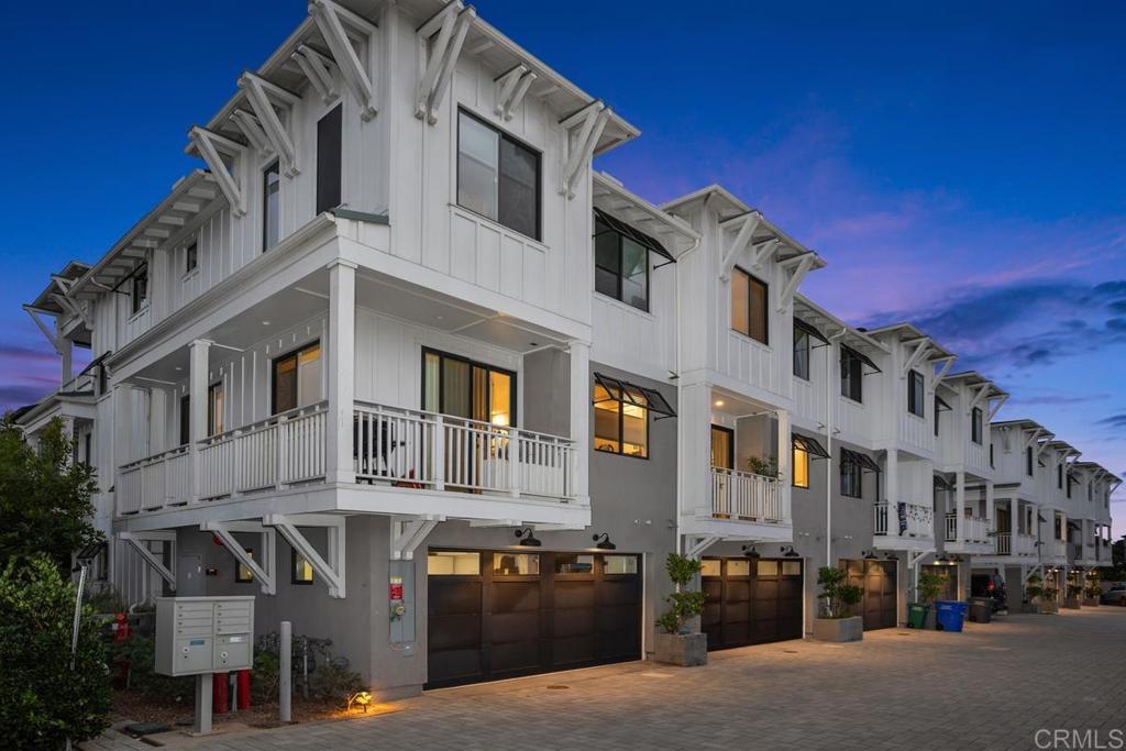 Best buy at the Beach/Village of Carlsbad! 5 yrs new. Only 1 of 8 Townhomes in this newer complex. Gated walkway to your home with front Patio. Real hardwood floors, upgraded shaker doors, air conditioning, Italian kitchen appliances, wine refrigerator. Area off of Kitchen would be great for small office area. Downstairs entry level with direct access two car garage. 4th room at entry level with full bathroom would be great flex room (bedroom, office, workout room, etc.) Above main level are 3 bedrooms with laundry room (closet) with side by side washer/dryer at that same level. Deck off of Primary Bedroom. Amazing opportunity to own down the street from beach, restaurants, train station.
