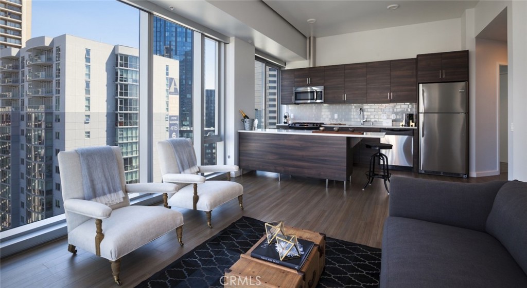 Listing duration reflects the overall community and may not represent this exact floor plan. Pricing and availability are subject to change—reach out today for the most up-to-date details!
Live above it all at 100 Van Ness, a premier high-rise community in the heart of San Francisco. Soaring 374 feet, the rooftop terrace delivers unmatched panoramic views of the Golden Gate Bridge, Bay Bridge, Twin Peaks, and more.
This pet-friendly building offers designer interiors with 10'4" ceilings, in-unit washer/dryer, maple KenLam flooring, stone countertops, and Juliet balconies. Select homes include dens and stunning city views.
Enjoy next-level amenities: two rooftop decks, a heated saltwater pool, yoga room, golf simulator, movie theater, basketball/pickleball court, and dual fitness centers—plus BBQ lounges, guest suites, on-site dry cleaning, and controlled access parking.
Hours of Operation: Sunday - Saturday 9:00 am - 6:00 pm
This is luxury, elevated. Welcome to 100 Van Ness.