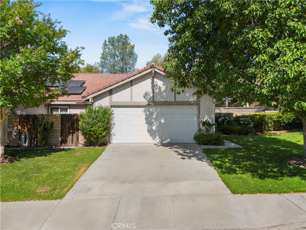 This beautifully maintained home offers an open, light-filled floorplan with three bedrooms and two bathrooms. The updated kitchen features quartz countertops, a glass tile backsplash, rich dark cabinetry and stainless steel appliances-refrigerator included.. Enjoy dark wood floors throughout, complemented by crown and base molding is some rooms. The primary suite has a private patio and an updated bathroom with a walk in shower, glass tile accents and matching dark cabinetry. Both bathrooms feature tile flooring.
ADDITIONAL HIGHLIGHTS INCLUDES:
Direct garage access to two car garage, washer and dryer included. Covered patio on one of the LARGEST LOTS in the tract. Only one neighbor. Large side yard with greenbelt next to it. Move-in ready and perfectly designed for comfort, style and privacy.