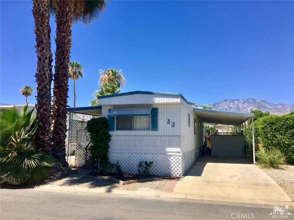 Single wide home now available inside 55+ Caliente Sands Mobile Home Park. Single wide with living room / porch addition, covered parking, and two garden sheds. Through-the-wall A/C unit in living room, and recently serviced roof-mount evaporative cooler. New refrigerator and new(er) wall oven. Satellite dish and receiver. Needs minor repairs, some TLC, and updating but perfectly comfortable living as is. Sold completely furnished. Purchaser and pets must be approved by Park Management. Site rental subject to rent control for a full-time resident. Motivated seller. All offers welcome! Caliente Sands park amenities include Pool & Spa, Clubhouse which has billiards, chess, library & much more.