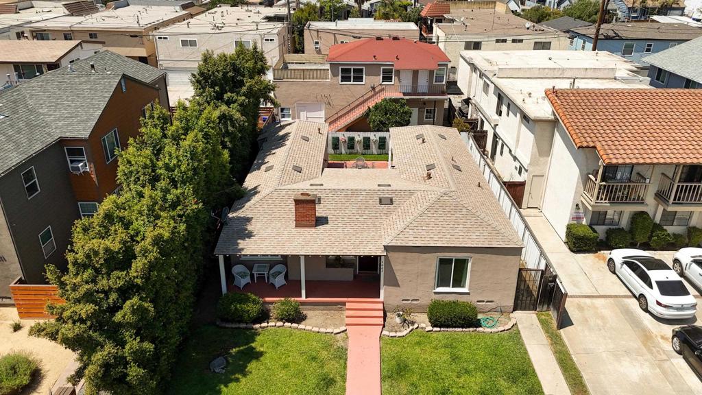 Your Home + Rental Income = Win-Win! Looking for a home that helps pay for itself? This unique property is the perfect solution. Enjoy living in the spacious front house while earning rental Income from the back unit—or keep it all for extended family. The options are endless! 4 Car Garage!! FRONT HOUSE 2Bd 2Ba Most windows are newer. A welcoming front porch to relax and enjoy the outdoors Bright living room with gleaming wood floors, a fireplace, and large windows Dining room with doors that open to a vast entertainer’s Upgraded kitchen with granite counters and custom cabinets The bonus room could be a laundry room or an office. A full bathroom that leads to a private backyard with an oversized patio area, an entertainer's delight. Carpeted bedrooms and plenty of natural light Gated entry with alley access for added privacy and security, BACK HOUSE 1bd 1ba Single level except for stairway access to unit with a full kitchen, bathroom, family room, and bedroom. The potential for a 2nd bedroom and still have a great family room area. Oversized private patio with beautiful views—perfect for relaxing or entertaining. Fenced yard with grass and a mature orange tree for shade and fruit Close to freeways, shopping, and great restaurants, Adams Ave., this home combines convenience with opportunity. Whether you want to offset your mortgage with rental Income, create a private guest space, or enjoy multi-generational living, this is truly a rare find you don’t want to miss! Look at the 3-car garage, endless potential! Another unit?
