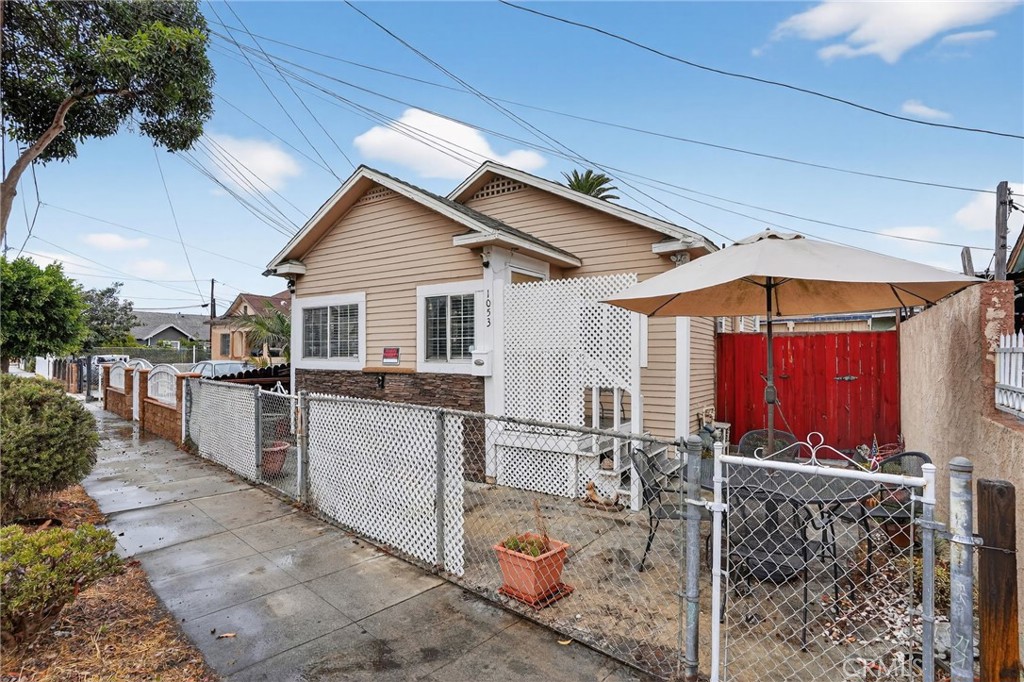 Welcome to 1053 E Hellman Street, where tiny house living meets the best of coastal California charm. Thoughtfully designed and full of character, this two-bedroom home is a refreshing alternative to condo life—offering the comfort of single-family living in a compact, efficient footprint. Inside, sunlight pours through the windows, highlighting open-concept living and dining areas that feel bright, airy, and intentional. The kitchen features sleek cabinetry, modern appliances, and clever storage that maximizes every inch. Each bedroom offers flexibility—perfect for guests, a home office, or creative studio space—while the home’s clean lines, quality finishes, and warm design touches create a sense of elevated simplicity. Located in a vibrant Long Beach neighborhood, you’ll be moments from local cafés, parks, and boutiques, and just a quick drive to the beach. This location delivers that walkable, small-space lifestyle tiny home enthusiasts love—close to everything, yet tucked into a welcoming residential community. Unlike a condo, this home offers more privacy, no shared walls above or below, and the freedom to personalize your space without HOA restrictions. At $499,000, 1053 E Hellman Street is your chance to become a homeowner and move in before the holidays, embracing the freedom, creativity, and charm that tiny house living inspires—all wrapped in approachable luxury on the coast of Long Beach.