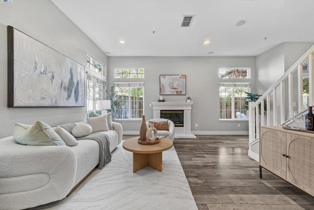 Welcome to this beautifully updated 3-bedroom, 2.5-bathroom corner-unit townhome in Pleasanton’s desirable Sienna community. Ideally situated near BART, I-580, and I-680, this home offers easy access to Dublin, downtown Pleasanton, and major shopping centers. Bright and modern, the home is filled with natural light and features an open-concept living room that’s perfect for both everyday living and entertaining. The kitchen is equipped with sleek manufactured stone countertops, a stylish tile backsplash, and a convenient bar area ideal for casual meals. The adjacent dining area opens to a charming, private backyard—perfect for relaxing or hosting guests. All three bedrooms are spacious, filled with light, and designed for comfort. Additional highlights include a water softener system, an epoxy-coated garage floor, and a 2-car side-by-side garage. Residents enjoy access to fantastic community amenities, including a pool, spa, clubhouse, and picnic areas—all with a low HOA fee. Don’t miss this move-in-ready gem in one of Pleasanton’s most convenient locations!