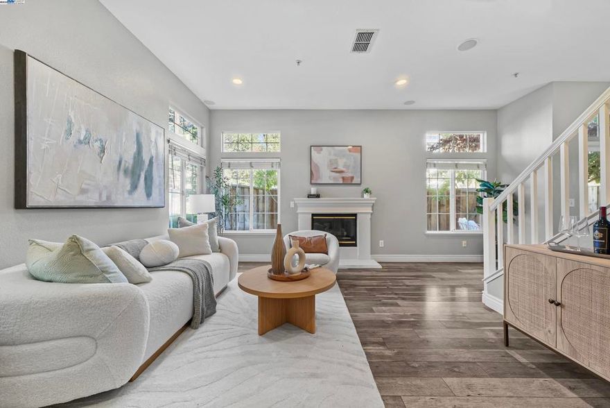 Welcome to this beautifully updated 3-bedroom, 2.5-bathroom corner-unit townhome in Pleasanton’s desirable Sienna community. Ideally situated near BART, I-580, and I-680, this home offers easy access to Dublin, downtown Pleasanton, and major shopping centers. Bright and modern, the home is filled with natural light and features an open-concept living room that’s perfect for both everyday living and entertaining. The kitchen is equipped with sleek manufactured stone countertops, a stylish tile backsplash, and a convenient bar area ideal for casual meals. The adjacent dining area opens to a charming, private backyard—perfect for relaxing or hosting guests. All three bedrooms are spacious, filled with light, and designed for comfort. Additional highlights include a water softener system, an epoxy-coated garage floor, and a 2-car side-by-side garage. Residents enjoy access to fantastic community amenities, including a pool, spa, clubhouse, and picnic areas—all with a low HOA fee. Don’t miss this move-in-ready gem in one of Pleasanton’s most convenient locations!