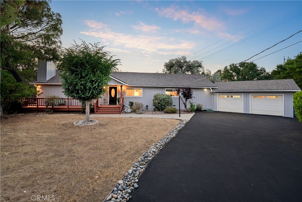 Welcome to 7025 San Gabriel — a well-maintained, single-level home nestled on 1.74 usable acres in a desirable Atascadero location. Offering approximately 1,824 square feet of living space, this 3-bedroom, 2-bathroom home combines comfort, functionality, and room to grow. The open floor plan is filled with natural light and thoughtful features, including wood ceilings in select areas, a cozy brick fireplace, and a mix of carpet, vinyl, and tile flooring. The open kitchen features granite countertops, updated appliances, and a huge walk-in pantry — perfect for storage and entertaining prep. The adjacent laundry area includes a utility sink for added convenience. The spacious primary suite offers tile flooring, a large walk-in closet, dual sinks, and a walk-in shower. The second bathroom includes a tub/shower combo and a generous vanity area. Step outside to a stunning wrap-around deck — ideal for enjoying coffee at sunrise or unwinding with a glass of wine while watching the sunset. The fully fenced property offers privacy, open space, and potential for expansion or hobby projects. Additional highlights include a 2-car garage with extra-deep storage, two storage sheds, abundant parking for guests, and a quiet setting just minutes from town, wineries, and local amenities. Don’t miss your chance to own this inviting home with endless possibilities!