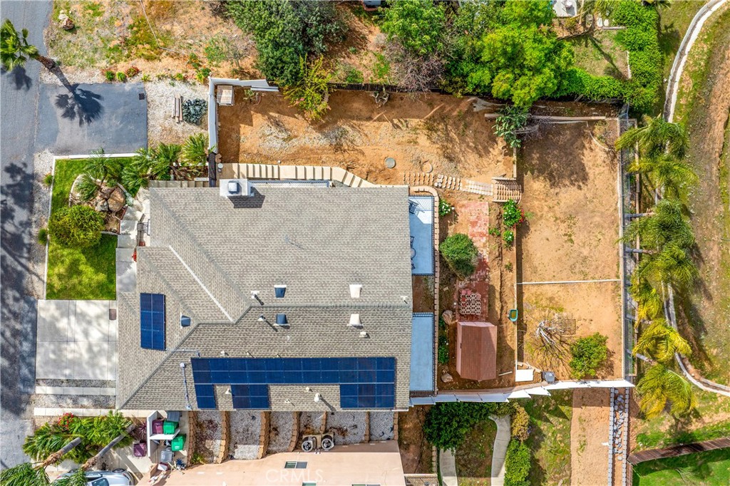 Stunning Panoramic Views from Mount Baldy to Big Bear! This custom-built home in Riverside offers breathtaking, unobstructed sunset views you have to see to believe. Step through the decorative wrought iron entry into an inviting open floor plan. The main level features a spacious living area, an office, and a chef’s kitchen with granite countertops, stainless steel appliances, ample cabinet space, a pantry, and a high-end cooktop range with a hood. The adjacent balcony is the perfect spot to soak in the spectacular scenery. The main-floor primary suite boasts its own private balcony overlooking the stunning landscape and a large walk-in closet. Its luxurious ensuite includes dual vanities, a soaking tub, and a separate stone-tiled shower. Downstairs, you'll find four generously sized bedrooms, a stylish common bathroom, a well-appointed laundry room, and a bonus room currently used as a game room. A lower third level offers a potential sixth bedroom, guest suite, or studio complete with a full bathroom and kitchenette—ideal for extended stays, multi-generational living, or to earn rental income. Enjoy the best of both worlds—serene country living with city conveniences just minutes away, including Tyler Mall’s shopping, dining, and entertainment. Don’t miss this rare opportunity to own a home with unparalleled views and versatile living spaces!