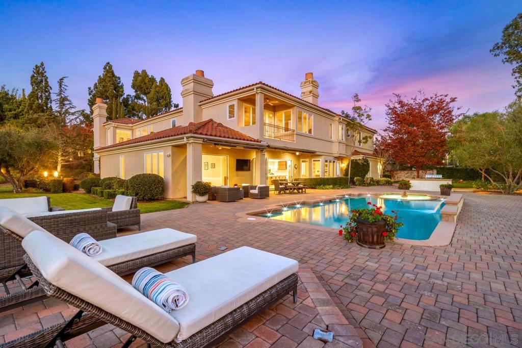 VALUE RANGE $5,150,000-$5,650,000. Exquisite and luxurious; relaxed and refined - this Poco Lago estate residence is a RARE gem designed for entertaining and effortless living! Nestled in a private and tranquil setting, this gated estate was built in 2000 and spans an impressive 7,916 square feet on a sprawling one-acre lot. The residence features over 5 bedrooms and 6 ½ baths, making it ideal for multi-generational living. An ATTACHED Carriage House includes a bedroom, ensuite bathroom, living room, and kitchenette, along with a downstairs full guest suite that also has an ensuite bathroom, both featuring separate entrances for added privacy. FEATURES - Primary Suite with dual walk-in wardrobes, dual en-suite, fireplace and private balcony! Wine Cellar, ELEVATOR, Secondary Office, Gym, ATTACHED Carriage House, Outdoor Oasis with Pool, Spa, Built-in BBQ, Bar, Fire Pit and generous entertaining space! Comfortable and Stylish with practically appointed custom features situated on an expansive lot offering breathtaking lake views, this estate has it all! Generously sized secondary bedrooms with en-suite and walk-in closets are located just down the hall from the primary suite providing space and privacy. Residents of Poco Lago cherish private lake access, along with parks and trails for hiking, jogging, and equestrian activities. Just minutes away from world-class amenities, this home offers the perfect blend of luxury and lifestyle. Don’t miss the opportunity to make this breathtaking estate your own! ADDITIONAL FEATURES - La Cantina doors, Solar, Central Vacuum, designer Chandeliers, recessed lighting, security system, Tankless Water Heaters, tall coffered ceilings, elegant crown molding, window casings, Plantation Shutters and built-in speakers throughout with surround sound.