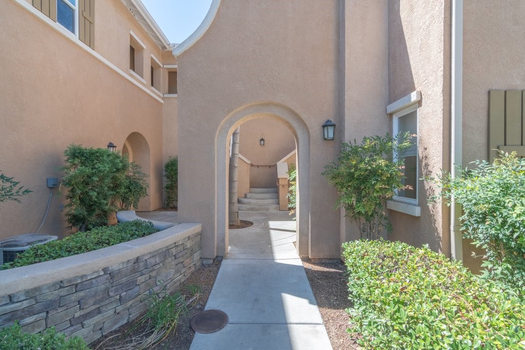 Beautifully maintained 2-bedroom, 2-bathroom condo located in the highly sought-after Verona Community in Murrieta. This home features a spacious kitchen that seamlessly flows into the dining area, a cozy living room with a fireplace, and a private balcony for outdoor enjoyment. This condo features a detached 1-car garage. HOA dues and trash service are included. The gated community offers resort-style amenities including a pool, spa, and fitness center. Ideally located just minutes from freeway access, shopping, schools, and parks.