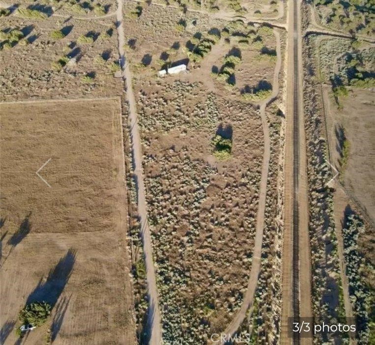 HUGE flat lot with plenty of room to build that dream your buyer keeps talking to his friends about !! Shed and existing mobile home on property sold in its present condition. Corner lot sits in cul-de-sac with lots of trees & breathtaking mountain view. Northern side of lot has a fence. Per seller water and electric ready to go! Propane needed for gas. Build your dream home on this lot.