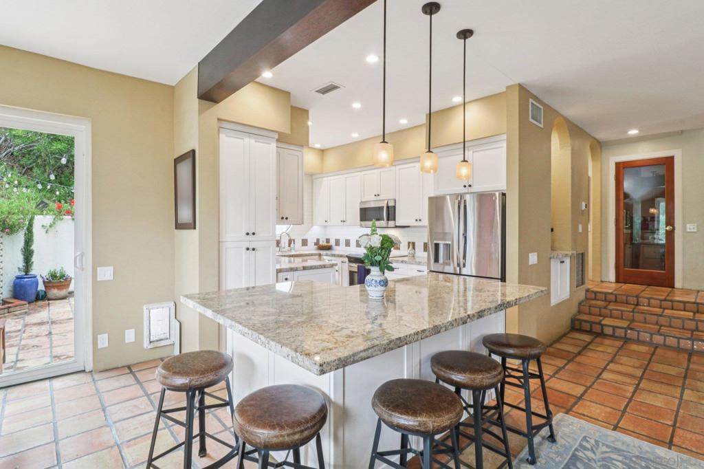 This is the lowest priced detached 3-bedroom single-family residence in all of La Jolla—by nearly $800,000! Designed by award winning architect Stuart Baesel. Located in a private enclave of just five detached homes, this is the largest and best-positioned of the group, tucked away from the main road and backing to a serene open canyon. The home features a newly remodeled kitchen with sleek stainless steel appliances, a large walk-out patio perfect for entertaining, and 2 private balconies off the upstairs bedrooms - each bedroom has access to a balcony. The spacious primary suite includes a fully built-out walk-in closet and a cozy fireplace—one of two in the home. Energy efficiency meets peace of mind: the brand-new roof is topped with solar panels, and the seller will pay off the system in full at close of escrow. A Tesla backup battery is also included and installed on-site for added energy security. Additional features include a custom wine cellar, 2 fireplaces, and walk-in closets. Near La Jolla Schools, Opportunities like this are rare in La Jolla. Don’t miss your chance to own the best-priced detached home in one of San Diego’s most sought-after neighborhoods. Permitted addition not reflected in MLS square footage (refer to Matterport for actual size)