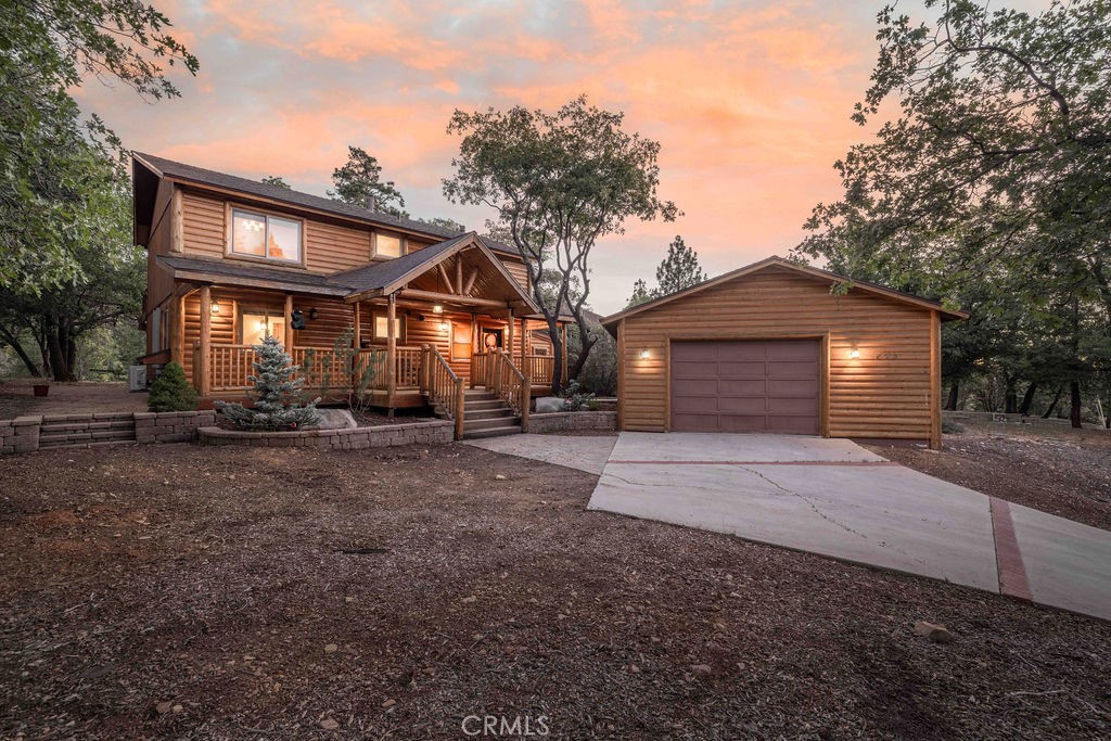 Beautifully updated Moonridge retreat backing directly to the National Forest on a rare flat lot with no rear neighbors, incredible views, and unmatched outdoor access. The backyard feels like forest-front property offering space to play, hike, or sled right from your door, with panoramic views of Bear Mountain from the back decks. Unlike many sloped lots, this lot is usable, kid and pet friendly, and ideal for year-round enjoyment. Inside, the home blends mountain charm with modern updates, including vaulted beamed ceilings, two fireplaces, a spacious family/game room, and a bonus office currently used as a 4th bedroom. Bathrooms have been tastefully remodeled with new tile, vanities, tubs, and fixtures. The kitchen features stainless steel appliances and newer cabinetry, opening to a warm and inviting great room with forest views through expansive windows. Nestled on a well-treed, serene street just minutes from the slopes, lake, golf course, zoo, and the new Moonridge Corridor. Complete with a 2-car garage and generous parking, this property truly has it all!