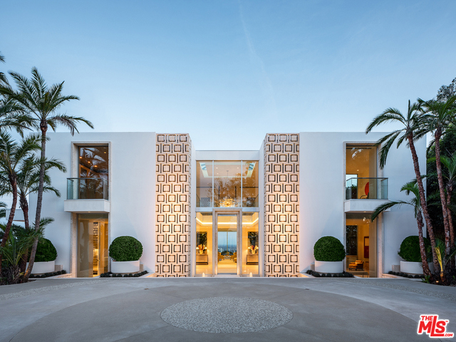 "The Promontory" Ultimate view estate sited on an approx. 3/4 acre point lot. A masterful creation by renowned Architectural designer Tim Morrison, this World-Class modern references elements of Hollywood Regency and the grand estates of Palm Beach. Meticulously crafted interior of approximately 11,000sqft showcasing unparalleled quality. Two-story skylight foyer, grand dining room, formal living room, and mid-century bar all flow effortlessly for entertaining. Spectacular master with explosive jetliner views, sitting room and dual baths. Additional features include a sumptuous screening room, 4 bedrooms, gym, and gourmet kitchen. One of the few drive-on view estates, behind gates with a vast motor court and 4 car garage. The rear grounds offer spectacular formal gardens and dramatic floating zero edge pool. Destined to be a legend.