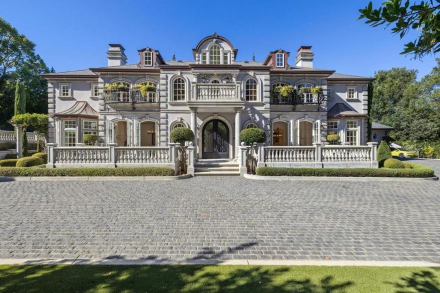 This stunning mansion is located in Saratoga's most prestigious Montalvo neighborhood, and has just completed a beautiful interior remodel.. Wrought iron gates and granite cobblestone driveway welcome you to this one-of-a-kind masterpiece on almost one acre. The French limestone balustrades and dormer windows overlook exquisite landscaped gardens. The home features high-quality custom finishes, including gorgeous new Taj Majal counter tops, solid walnut woodwork, new lighting and artisan-crafted fireplaces. Grand formal rooms are complemented by a gourmet kitchen featuring a limited edition Viking range, quaint dining nook, grand family room, and office/library. Five bedrooms on two levels include two suites upstairs, including the luxurious primary suite with fireplace, newly customized walk-in closet, and spa-like bath. A detached ADU features leaded glass windows, built-in cabinetry, fireplace, kitchen and full bath. Below features a full gym. Exceptional grounds feature a pool and spa, sports court, two outdoor kitchens, two fireplaces, pizza oven, a vast level lawn perfect for large outdoor gatherings or possible SB9, an architectural gazebo, and a redwood grove. Minutes to Villa Montalvo Arts Center, Saratoga Village, and top-rated Saratoga schools.