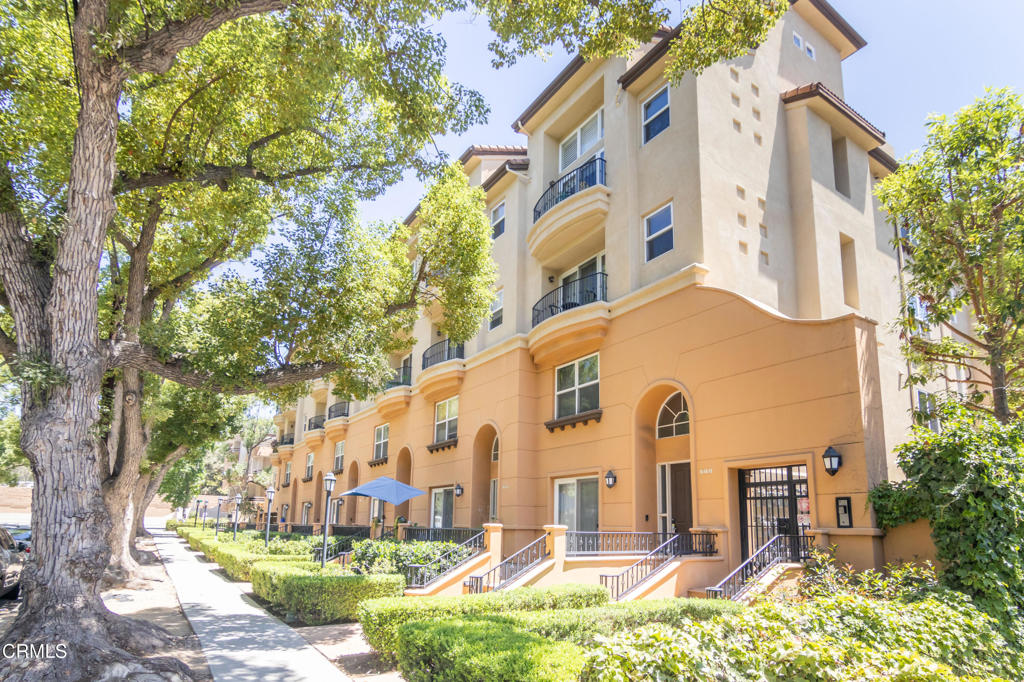 Built in 2003 and located in the popular Madison Walk Condominium complex, this unit is move-in ready. As you approach the unit, there is a lovely front patio perfect for alfresco dining. Upon entering, you'll notice soaring ceilings and a grand staircase leading to the versatile loft area. As you pass through the entryway, the space opens and welcomes you to the expansive great room with views out to a Juliet balcony and towering oak trees. Off the great room, there is a nicely appointed kitchen. The primary bedroom, with a walk-in closet and en-suite bath with dual sinks and a walk-in shower, completes the first floor. At the top of the grand staircase, you will find the loft complete with a full bath, closet, and private patio. This flexible space can be used as a workspace, reading nook, or guest room. The unit comes with two parking spaces (P37), which are tandem. Madison Walk Condominiums is a clean, well-maintained condominium complex with low HOA fees ($299.40), and offers secured access, a common area barbecue area, six guest parking spots, and is steps to everything Pasadena's Play House and Civic Center districts have to offer.