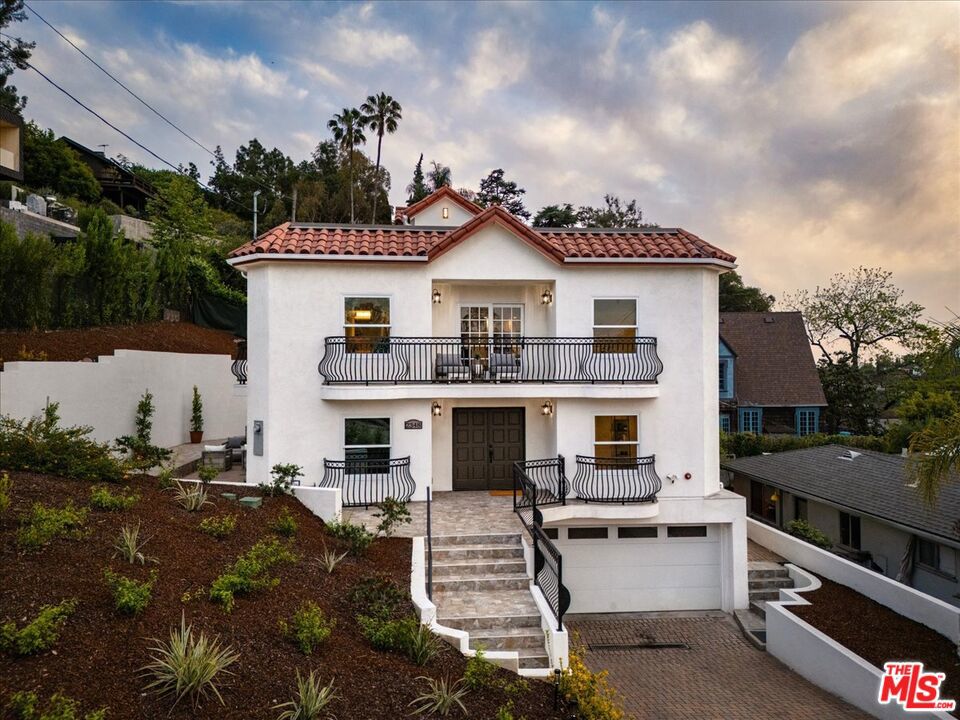 Available For Lease...Looking for paradise in Silver Lake? You've found it. Built in 2024, this Mediterranean-style gem spans 3,508 sq ft and offers breathtaking views of the Silver Lake Reservoir. With 5 spacious bedrooms, 5 bathrooms, and seamless indoor-outdoor flow with balconies all around, this home has everything you need to live comfortably, host elegantly, and unwind in your ultimate urban sanctuary. As you enter the double-doors on the main floor, you are welcomed to a large living space with a balcony as well as three en-suite bedrooms, including the primary suite. Taking the elegant spiral staircase up, you enter the main living area with two more bedrooms, the dining space that opens up to another beautiful balcony with reservoir views, as well as the open kitchen with stainless steel appliances, including a double oven perfect for the chef of the home! The expansive rooftop deck has incredible 360 views, and the lower level boasts over 700 sq ft of finished basement space, an extra storage area, and a two-car garage leading out to a long driveway, providing ample space for parking. Conveniently located close to the reservoir as well as Silver Lake's best cafes, shops, and restaurants, this is more than a home, it's a lifestyle. Don't miss the opportunity to make it yours!