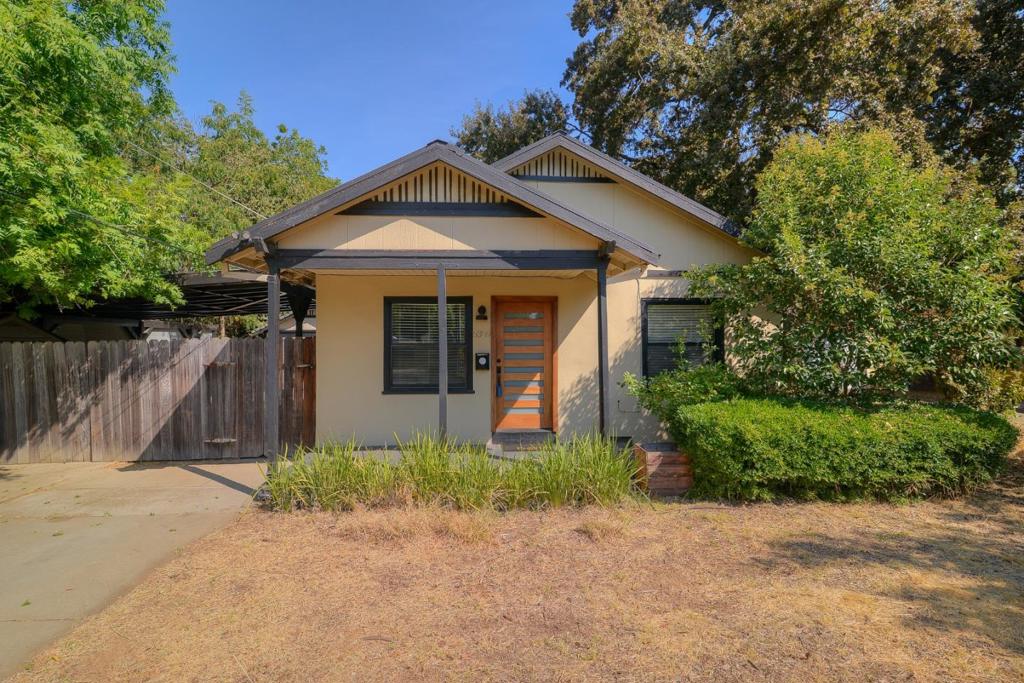 Charming 1930s Bungalow in Tahoe Park Move-In Ready! Discover this beautifully updated 2-bedroom, 1-bath bungalow that blends timeless character with thoughtful modern upgrades. Recent renovations include a remodeled kitchen with granite countertops, tile backsplash, new flooring, updated plumbing, a new 220-amp electrical panel ready for EV charging, and sleek stainless steel appliances. An in-unit washer and dryer and central heating and air ensure year-round comfort and convenience. Step outside into an oversized backyard oasis featuring mature fruit trees, garden beds, and abundant space for entertaining, relaxing, or enjoying your outdoor lifestyle. A large shaded carport, detached garage, root cellar, and multiple sheds offer flexible storage and workshop options. Plus, the expansive lot with existing concrete pads provides a fantastic opportunity to build an ADU, RV parking, or even a studio space. Situated in the highly sought-after Tahoe Park neighborhood, this move-in-ready home offers the ideal balance of historic charm, modern amenities, and exciting future potential for growth.