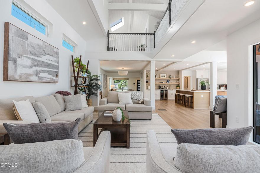 Located in the highly desirable Toluca Lake neighborhood, this extraordinary four-bedroom, four-bath residence of nearly 3,500 square feet has been fully reimagined into a turn-key sanctuary where no expense was spared. Originally built in 1947, the home retains its timeless character with vaulted ceilings, exposed wood beams, expansive walls of glass, and tongue-and-groove detailing, now elevated by thoughtful renovations and luxury upgrades.Recent improvements include a brand-new roof, a double electric security gate for the driveway, a newly gated trash enclosure, and completely redesigned landscaping in both the front and back yards. Modern comforts abound with a new tankless water heater, a water circulation system, and a state-of-the-art full home security system. Inside, custom shelving in the pantry and garage, a newly designed walk-in closet, and bespoke draperies and shades add both elegance and functionality.The home's light-filled interiors feature skylights and French doors that open to private patios and gardens, creating seamless indoor-outdoor living. The primary suite serves as a serene retreat with its own sitting area and balcony overlooking the grounds. Upstairs are two additional bedrooms and a versatile den, ideal for a home office or media room, while a guest-ready ensuite on the main level provides convenience and flexibility.Set on a generous 8,200+ square foot lot, this residence balances refined interiors with beautifully landscaped outdoor spaces. Its location places it moments from top restaurants, boutique shopping, cafes, and major freeway access, offering the perfect blend of luxury and everyday convenience.More than a home, this is the transformation of a classic Toluca Lake property into a sophisticated, move-in ready haven. Every detail has been carefully considered, creating a rare opportunity to own a timeless residence that combines architectural pedigree with modern enhancements.