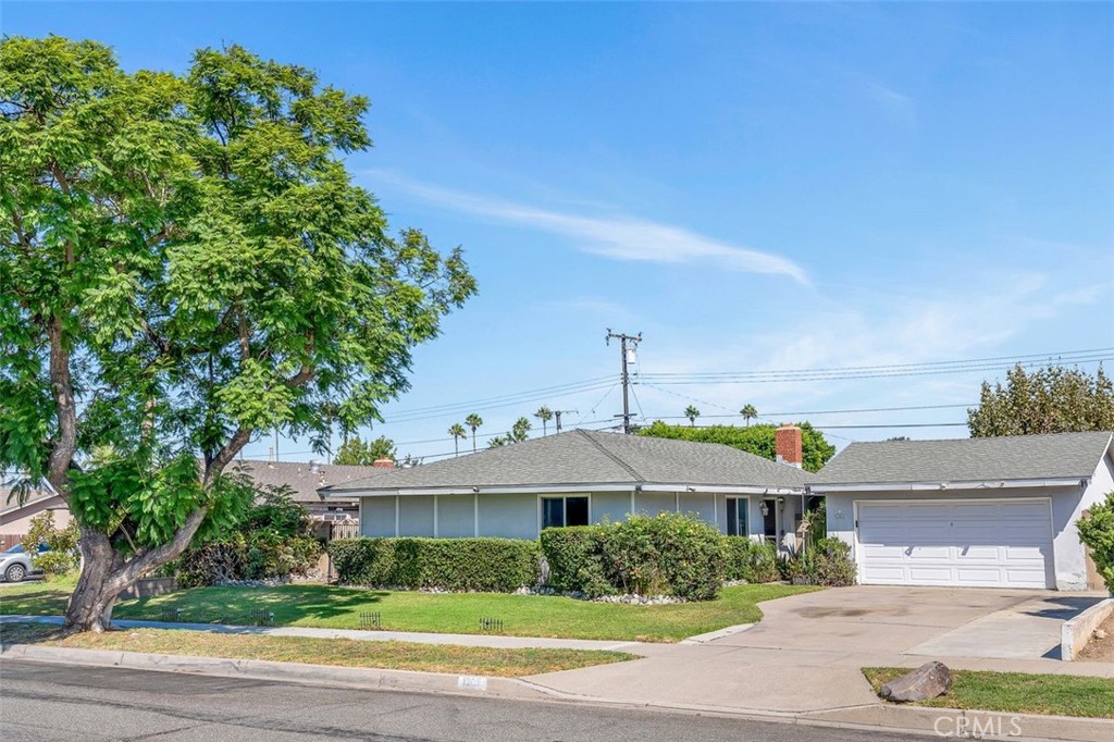 Welcome to a rare opportunity in a highly accessible location—this single-level residence offers endless potential for those with vision and creativity. Situated on an expansive lot of over 8,000 square feet, the property features a generous layout with three bedrooms and two bathrooms, providing a versatile foundation for personalization and enhancement.
The home begins with a welcoming double-door entry that opens into a spacious interior filled with abundant natural light, thanks to well-placed windows throughout. The inside laundry area is conveniently located off the hall bathroom and adjacent to the kitchen, offering easy access and functionality for daily routines. A detached two-car garage and extended driveway provide ample space for vehicles, storage, or future possibilities.
Outdoors, the backyard is a standout feature—wide, open, and enclosed for added privacy with block wall fencing. It presents a blank canvas for landscaping, entertaining areas, or even expansion projects. Whether you’re envisioning a garden retreat, play area, or outdoor kitchen, there’s room to bring your ideas to life.
While the property will benefit from some TLC, its generous lot size and layout make it an exciting opportunity for anyone looking to create a personalized space that reflects their unique style and needs. Located near Eisenhower Park, The Village at Orange, and major freeways including the 55, 91, and 57, the home offers convenient access to shopping, dining, and recreation.
This is more than just a home—it’s a chance to shape a space with imagination and purpose. Let your creativity lead the way today!