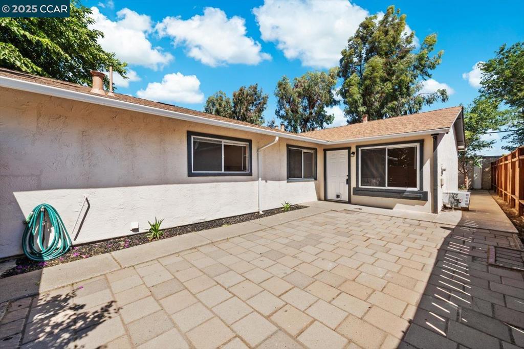 Welcome to 113 E Trident Drive, a charming and affordable duet-style home in the heart of Pittsburg. This single-level residence offers three bedrooms, one bathroom, and approximately 817 sq ft of functional living space. The converted garage adds flexibility as a third bedroom or bonus area. Inside, a spacious living and dining area flows into a clean, functional kitchen with generous storage and open access to the main living and dining space - ideal for everyday living. Laminate flooring runs throughout the entire home for a cohesive, easy-care finish. All bedrooms are light-filled and ready for your personal touch. The bathroom features modern finishes and ample storage. Outside, enjoy a low-maintenance yard and a great location just minutes from the Pittsburg Marina, Bay Point Regional Shoreline, shops, dining, BART, and freeway access. Eligible buyers may qualify for a $10,000 Wells Fargo Grant Program for down payment assistance – ask for more information. A great opportunity to build equity in a well-connected neighborhood.
