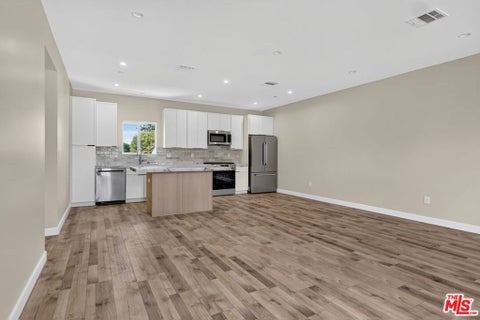 Photo of 7409 1/2 Densmore Avenue, Van Nuys, CA 91406 (MLS # 26104570)