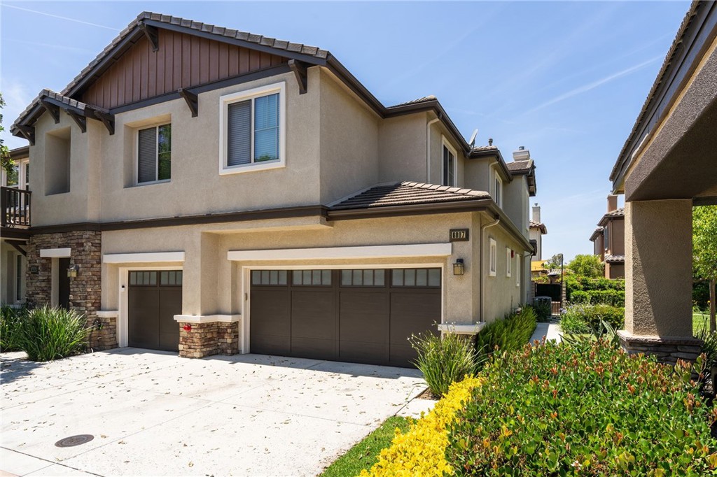 Welcome to 6807 Simmons Way, a thoughtfully upgraded home nestled in Moorpark’s sought-after Waverly Place Community. This modern residence combines high-end finishes with smart-home convenience for effortless everyday living. Inside, you’ll find upgraded porcelain tile and luxury vinyl plank flooring, recessed LED lighting, smart control panels, and custom details throughout. The chef’s kitchen features marble countertops, a full-height backsplash, stainless steel appliances, and built-in USB ports. The living area offers a Nest thermostat, gas fireplace with programmable timer, dimmable lighting, and a contemporary ceiling fan with Wi-Fi controls. The primary suite is a true retreat with a fully remodeled spa-style bathroom—frameless glass shower, soaking tub, quartz vanity with USB-integrated cabinetry, Bluetooth speaker lighting, and a custom walk-in closet. Upstairs bedrooms include built-ins like a Murphy bed, desk stations, and modern fans, all enhanced with smart tech and clever storage. Enjoy energy-efficient upgrades like a whole-house evaporative cooler and EV-ready garage with 240V outlet, plus a low-maintenance backyard with artificial turf, travertine patio, sun shade sail, and outdoor TV setup. Located minutes from parks, shopping, and top-rated schools, this home is the perfect blend of comfort, convenience, and elevated style.