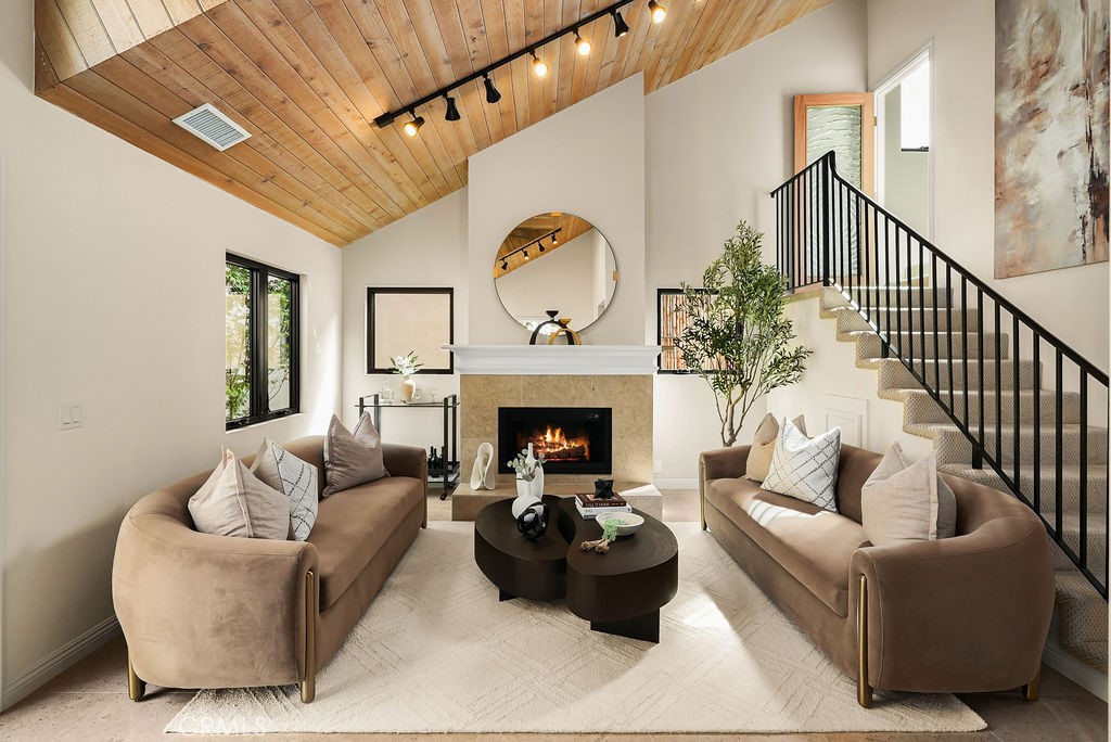Live the real CdM lifestyle at 441 1/2 Goldenrod in Corona del Mar, where coastal tradition shines with elevated style. Completely updated and positioned on a prized corner lot in the heart of the Village, this home is your private sanctuary, ready for entertaining and everyday life. Meticulous upgrades set the tone, with a main living area featuring soaring ceilings and a refreshed, sunlit design that creates an airy, inviting feel throughout. Step outside to your own patio off the main living space, comfortably enclosed by mature trees and lush greenery, perfect for relaxing or gathering with friends. Enjoy the rare luxury of three full baths, offering incredible flexibility for guests and daily living. The rooftop deck is your ultimate escape: soak up the sun, sip your morning coffee, and savor coastal breezes. Here, you’re surrounded by everything that makes Corona del Mar legendary: local cafés, boutiques, award-winning schools, and breathtaking beaches all just a short stroll away. This is truly an unparalleled lifestyle, grounded in integrity, a strong sense of community, and true coastal character, with every comfort refreshed for modern living. It's authentic, effortless, and exactly where you want to be. Call now for your private showing.
