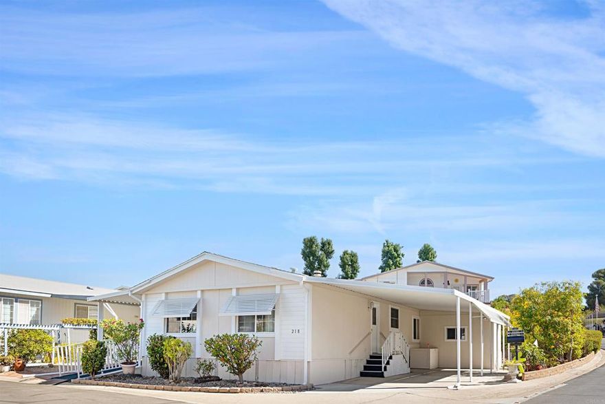 Comfortable three bedroom home on corner lot in premier senior park.  Home has been lovingly cared for and has an open floorplan with large living room, dining room and spacious kitchen.  The three bedrooms are all generously sized and there is plenty of storage.  Additionally there is a laundry room, wheelchair ramp and covered patio to enjoy your morning coffee!  The fully accessible yard offers room for container gardening along with a shed for your tools.  The Meadows is HOA style ownership which means there is no space rent, only the low HOA fee of $319 per mo.  The fee includes trash, water, limited cable TV and all amenities.  This active community has a year round heated salt water pool & spa, pickleball/tennis courts, putting green, clubhouse, and much more!  Located only 15 minutes from medical, shopping and entertainment and Lake Jennings is just five minutes away.