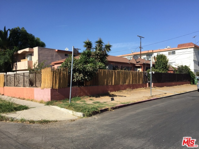 Cosmetic fixer. Nice 2 unit building. Consists of front 2 bed and 1 bath house with an attached large 1 bed 1 bath unit behind it. The garage was converted to a 1 bed and 1 bath. Chance of a lifetime to own 2 units on this large corner lot in prime Palms. Just 2 blocks from the new Metro station. Properties owner occupied and will be delivered vacant at close of escrow.