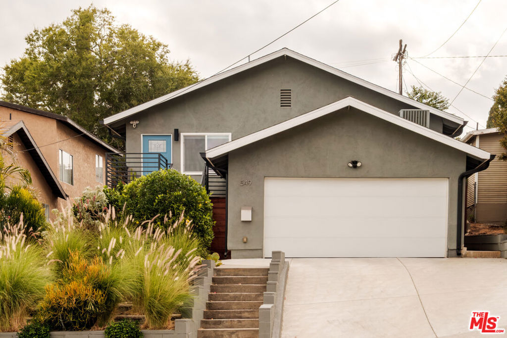 Set in the heart of Highland Park, this freshly updated three bedroom home combines modern comfort with warm, inviting design. The bright, open layout feels spacious and airy, featuring new floors that flow seamlessly throughout, including a beautifully refreshed kitchen with updated finishes and plenty of counter space for cooking and entertaining. The primary suite is a true retreat with a large walk in closet and a stylish ensuite bathroom. Two additional bedrooms offer flexibility for guests, a home office, or a creative studio, while both bathrooms feature new vanities and thoughtful upgrades that create a clean, contemporary vibe. Outside, the private backyard is designed for relaxation and connection, with new turf, a sleek Pergolux pergola, and plenty of space for lounging, grilling, or gathering with friends under the LA sun. The two car garage includes an EV charger, and the home comes equipped with central air, heat, and in unit laundry for everyday ease. Enjoy being minutes from Highland Park's top dining spots, coffee shops, and nightlife, all while coming home to a peaceful, move-in ready haven that reflects the creative energy of Northeast LA living.