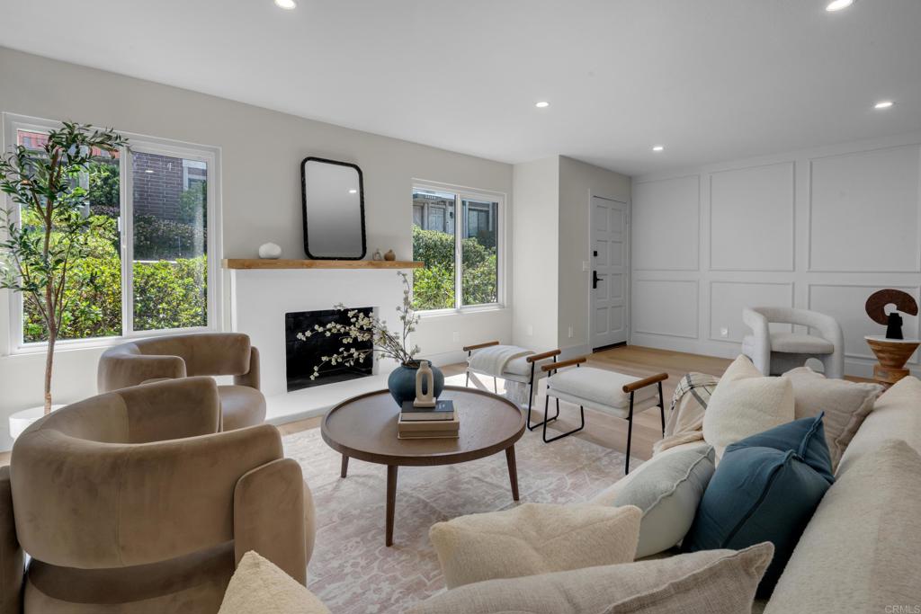 Discover this fully renovated townhome in Ridgegate’s gated community, where modern style meets everyday comfort. Light-filled interiors feature new luxury flooring, a sleek smooth-stucco fireplace, and a designer kitchen with quartz counters, custom cabinetry, matte gold hardware, and stainless appliances. Upstairs, the serene primary suite offers a walk-in closet and spa-like bath with dual vanities, a spacious walk-in shower, and chic finishes. Two additional bedrooms - with peekaboo ocean views - provide flexibility, while beautifully upgraded bathrooms complete the home. Enjoy your private patio, which directly accesses a spacious two-car garage complete with laundry hookups, plus the comfort of new windows and central A/C. Residents enjoy resort-style amenities including multiple pools, tennis and pickleball courts, lush greenbelts, and 24-hour guarded gates—all minutes from award-winning schools, beaches, hiking trails, Terranea Resort, and Trump National Golf Club.