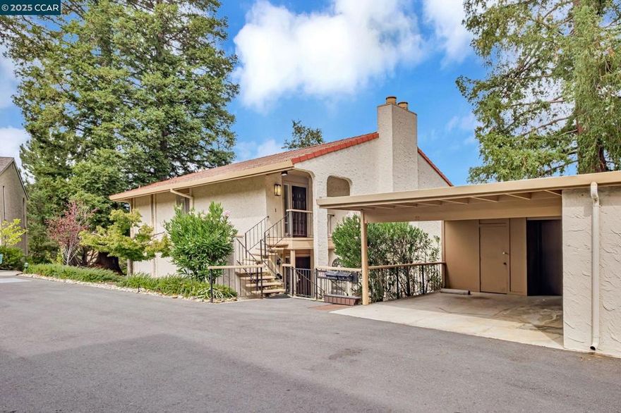 You’ll love the two spacious balconies offering fantastic golf course views! Enjoy serene vistas of rolling hills framed by both deciduous and evergreen trees. This desirable Villa Madrid model is a duplex that lives like a penthouse, with no shared walls for exceptional privacy.  The elegant living room features a beautiful fireplace and classic wainscoting, creating a warm and inviting atmosphere. The kitchen offers abundant counter space and a large pantry, while the breakfast room is perfect for casual dining. The primary suite includes a secluded private balcony—your own peaceful retreat.  A covered, oversized carport with a storage room is conveniently located at the bottom of the stairs. The Mutual (HOA) also offers its own club room for residents to enjoy.