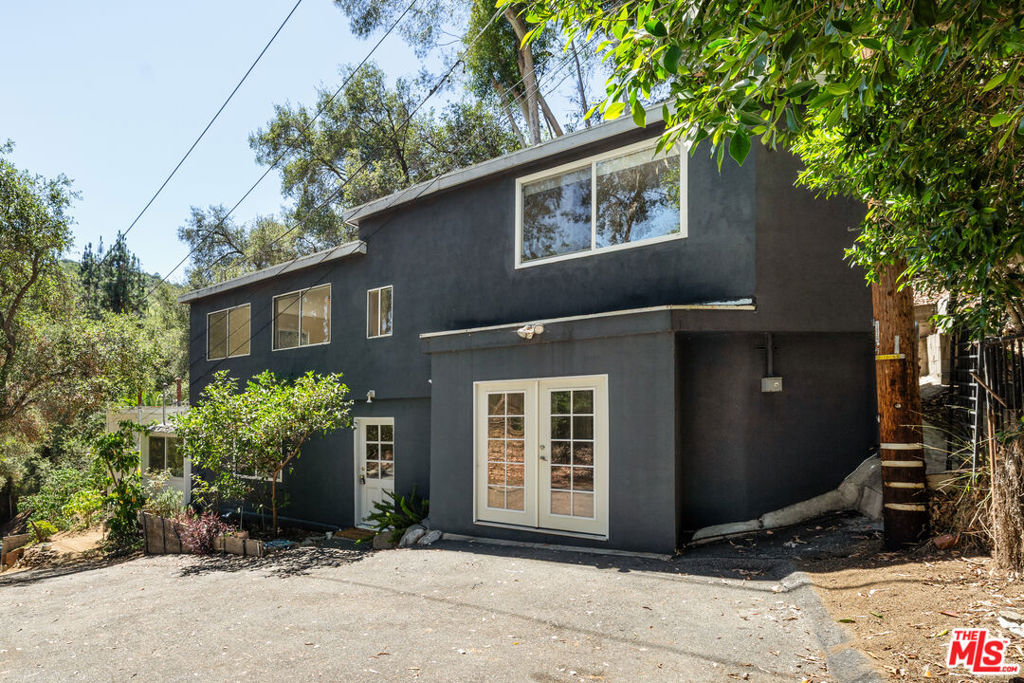 Imagine winding up a private road, where the city noise fades and the canopy of trees opens to reveal your own secluded retreat. At the end of the lane, tucked into the hillside, sits a charming 3-bedroom, 2-bathroom home--2,000 square feet of Laurel Canyon magic. Inside, warm and inviting living spaces blend with the natural setting just outside every window. The home's layout offers flexibility for families, professionals working from home, or creatives in need of inspiration. Step outside and you're embraced by nature in every direction, making this residence as peaceful as it is private. The home has a basement for extra storage or a flex space. Located in the highly sought-after Wonderland School District, this is the perfect retreat for those looking to balance canyon serenity with convenient access to Los Angeles.