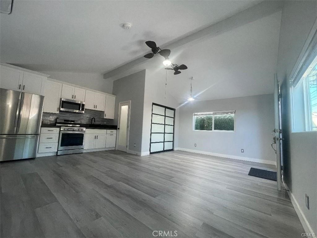 Tastefully designed studio ADU with 420 plus square feet. Features include a full kitchen with stainless steel appliances, refrigerator, gas Stove and a microwave. This home offers Laminated flooring, double pane windows, new remote controlled wall-mounted unit for heat and air conditioning. The ADU has its own private entrance from the alley which runs along the rear of the property. All utilities included in the rent.