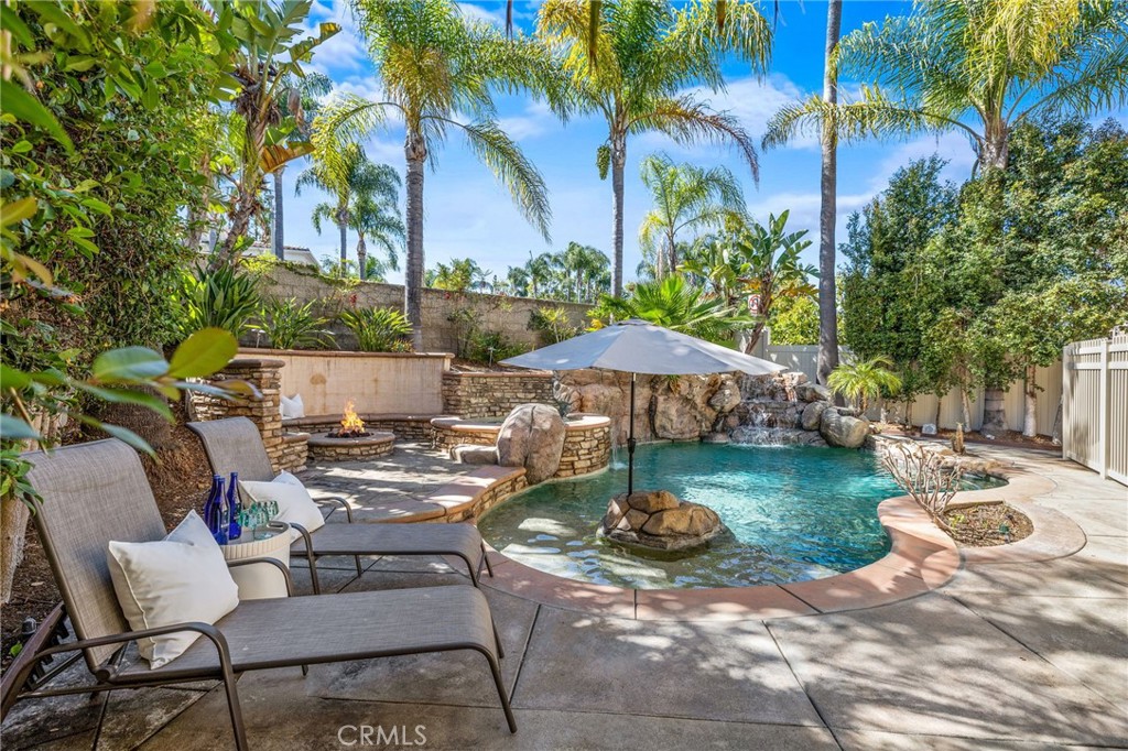 Welcome to your home oasis. Nestled on a quiet, sought-after street in the vibrant community of Aliso Viejo, this beautiful 4-bedroom, 2.5-bath home combines comfort, style, and resort-like amenities for the ultimate Southern California lifestyle. Step inside to discover a light-filled interior with ample windows throughout, accented by timeless plantation shutters that offer both charm and functionality. The thoughtfully designed floor plan includes a formal living and dining room with a vaulted ceiling, creating the wow factor upon entering the home. The spacious kitchen that opens seamlessly to the family room, creating the ideal hub for everyday living. The private backyard is your personal paradise—featuring a safe environment that has a showstopper saltwater pool and spa with PebbleTec finish, a new heater, and a VSP pump for energy efficiency and year-round enjoyment. Gather around the built-in fireplace where ambiance meets relaxation and good company. Upstairs, you'll find four generously sized bedrooms, including a serene primary suite with ample closet space and a beautifully appointed en-suite bath. Additionally, the home is repiped with PEX, providing peace of mind in the integrity of the work. Enjoy living where you can walk to top-rated schools and a short drive to parks, shopping, and coastal beaches. This home is a rare opportunity to own a move-in-ready home in one of Orange County’s most desirable neighborhoods. Don’t miss your chance to make this resort-inspired retreat your forever home!