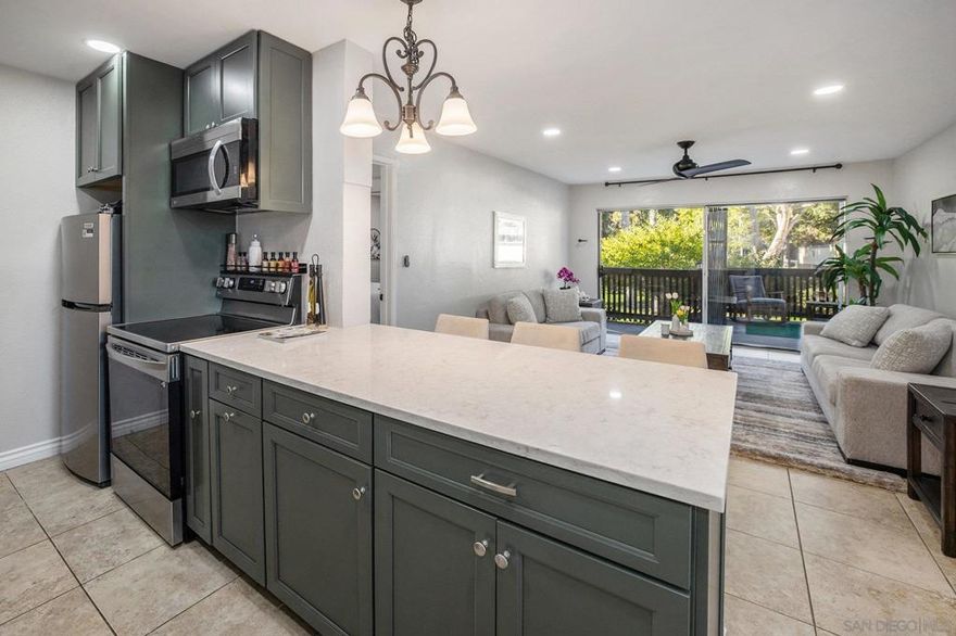 Welcome to this spacious and comfortable Fashion Valley condo, featuring two primary-style bedrooms on opposite sides of the home, each with a walk-in closet, direct balcony access, and its own bathroom for the perfect blend of privacy and comfort. Enjoy the extra-large balcony overlooking a peaceful stream, where you can relax, unwind, or even fall asleep to the soothing sound of running water. Inside, you’ll find recessed lighting, ceiling fans throughout, central A/C, and a cozy electric fireplace. Recent updates include a fully remodeled kitchen, a full bathroom remodel with added dual sinks, and partial renovations done to the second bathroom—all completed within the last 3 years. This end-unit home also comes with two parking spaces: one in the gated underground garage and one outdoor assigned space, both conveniently located directly adjacent to the unit. The HOA covers cable TV, water, trash, and more while the community-provided amenities include a pool, spa, gym, clubhouse, tennis courts, barbecue area, and pet area...all set in a gated, beautiful park-like setting. And when you are ready to explore the town, you will have easy access to everything since you will find yourself perfectly situated near Fashion Valley Mall, beaches, downtown, and all of San Diego’s best attractions. FHA and VA approved—with a VA assumable loan at 4.719%! Don’t miss your chance to own this rarely available gem in one of San Diego’s most desirable locations!