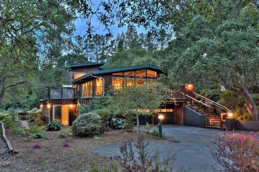 Move in condition and lovely views of the Western Hills. The homes versatile floor plan (officially 3 bedrooms and 4 baths) includes an expansive lower level with a large family room , extra storage area and a large guest / au pair suite /2nd home office. . The main level has an open living, dining and kitchen area, the Primary suite is amazing featuring: A gas fireplace in the bedroom a small private deck with views,  a large primary bathroom, with a large glass shower, 2 vanities and spacious dressing area, a huge primary closet.  Also on a 3rd level and in the Primary Suite area is a stunning office with views western hill and a private deck. You'll never go back to the office once you've worked here!  2 other bedrooms and baths are on this same level. The kitchen is a large entertainers island kitchen with state of the art appliances. The Living, Dining and Kitchen area opens to a new trex deck which boasts expansive views . The lower level offers a spacious family room with a fireplace . A full bath and a large storage area. Also on the lower level is an Au Pair or guest suite. Wonderful Views from the Hot Tub off the family room. A 2 car garage is located off the family room. The home has Solar Panels and 3 Tesla batteries as well as EV charging.