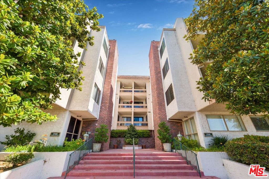 Welcome to this stunning, light-filled corner unit in the prestigious Horton Lane complex! Nestled directly across from Balboa Park Sports Complex, Encino Golf Course, and scenic Lake Balboa trails, this 2-bedroom, 2-bath condo offers over 1,700 square feet of thoughtfully designed living space and breathtaking views overlooking Balboa Park all the way to the mountains. Beautifully appointed, this single-level residence features an open floor plan with a step-down living room, elegant fireplace, and access to two private balconies ideal for indoor/outdoor living. The updated kitchen is complete with granite countertops, custom cabinetry, slate flooring, and stainless steel appliances. A spacious dining area and wet bar provide perfect settings for entertaining. Retreat to the oversized primary suite, offering dual closets including a large walk-in, a remodeled spa-style bathroom with double vanities, and access to the private balcony. The second bedroom also functions as a junior suite, complete with its own remodeled bath and in-unit side-by-side washer/dryer. Additional highlights include: laminate flooring, recessed LED lighting, dual-pane windows, central HVAC, and ample closet space throughout. The gated garage offers two tandem parking spaces and a private storage locker. Community amenities include a pool, spa, clubhouse, and tranquil walking paths with lush landscaping. Centrally located with easy freeway access, just two blocks from Trader Joe's and directly across from countless recreational amenities this is Encino living at its best!