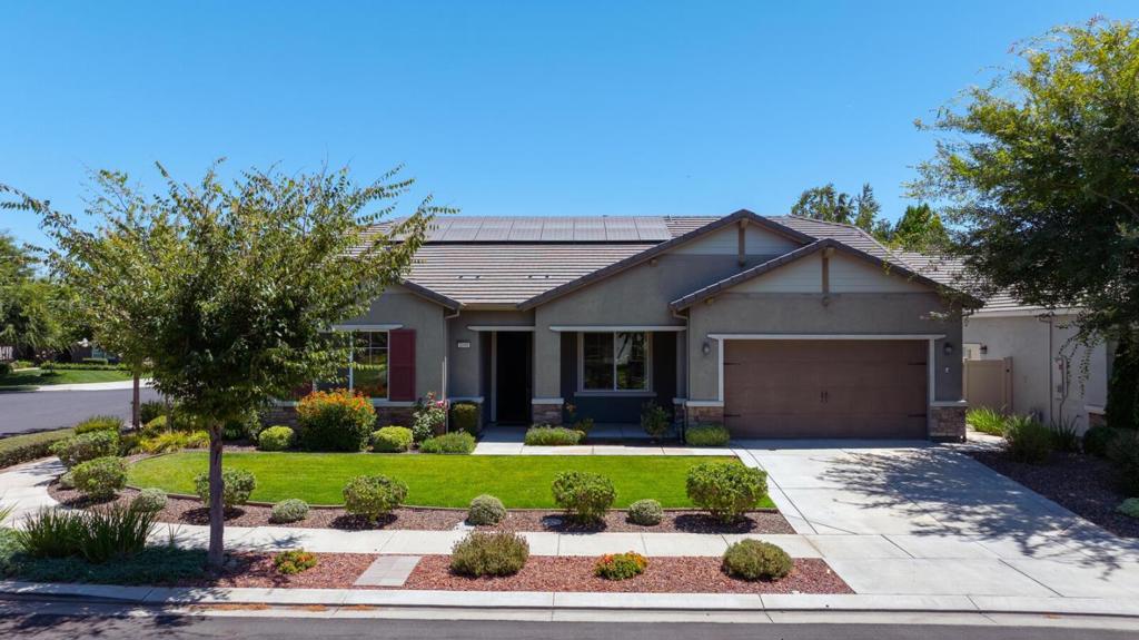 Elegance found in the Scholar Model on premium corner lot in the vibrant Del Webb Woodbridge 55+ community. Stunning 9 yr old 2,379 sqft beauty boasts 3 bedrooms & 2 baths, blending luxury & functionality. Next to Liberty Park scenic walking trails, tranquility & active lifestyle. Gourmet kitchen features sleek granite counters, cherry wood cabinets, walk-in pantry. Open living area flows seamlessly, an ideal space for entertaining or quiet evenings at home. Ample dining spaces for every occasion, expansive, luxurious master, bath w/a sunken tub. Low-maintenance backyard oasis with two covered patios, a built-in outdoor kitchen/BBQ, & cozy gas fire pit. Owned energy efficient solar panels, making this home as practical as it is beautiful. The oversized garage offers tandem parking, workshop, extra storage, workout area, endless possibilities. Packed with upgrades, generously sized guest bedrooms including built in cabinets/bookcase. Del Webb Woodbridge community elevates your lifestyle w/access to multiple new pickleball courts, a clubhouse, indoor & outdoor pools/spas, fitness center, library, billiards, tennis courts, putting green, & stocked lake for catch-and-release fishing. Enjoy concerts in the amphitheater. Connect w/neighbors through a variety of clubs & activities.