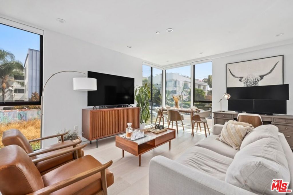 A Modern Luxury home in the prime Hollywood Studio District. This 3-level residence (plus private roof patio) features an open floor plan with 3 bedrooms, 4 bathrooms, and upscale finishes throughout. Enjoy the spacious rooftop patio with breathtaking 360 city views stretching from the Hollywood sign to the Downtown skyline, your own private outdoor oasis. Just blocks from La Antica Pizzeria, Sugarfish, K&L Wines, Neue House, Equinox, and Runyon Canyon. Surrounded by Sunset & Gower Studios, Netflix, Paramount, and Raleigh Studios and minutes to Los Feliz, Silver Lake, DTLA. A rare blend of easy modern living in the heart of city.